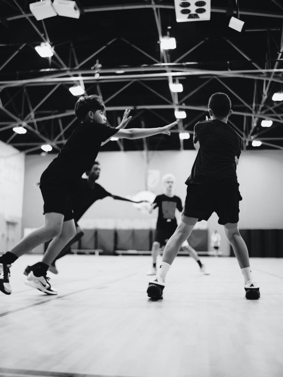 Players defending and passing during CHAMPS basketball practice